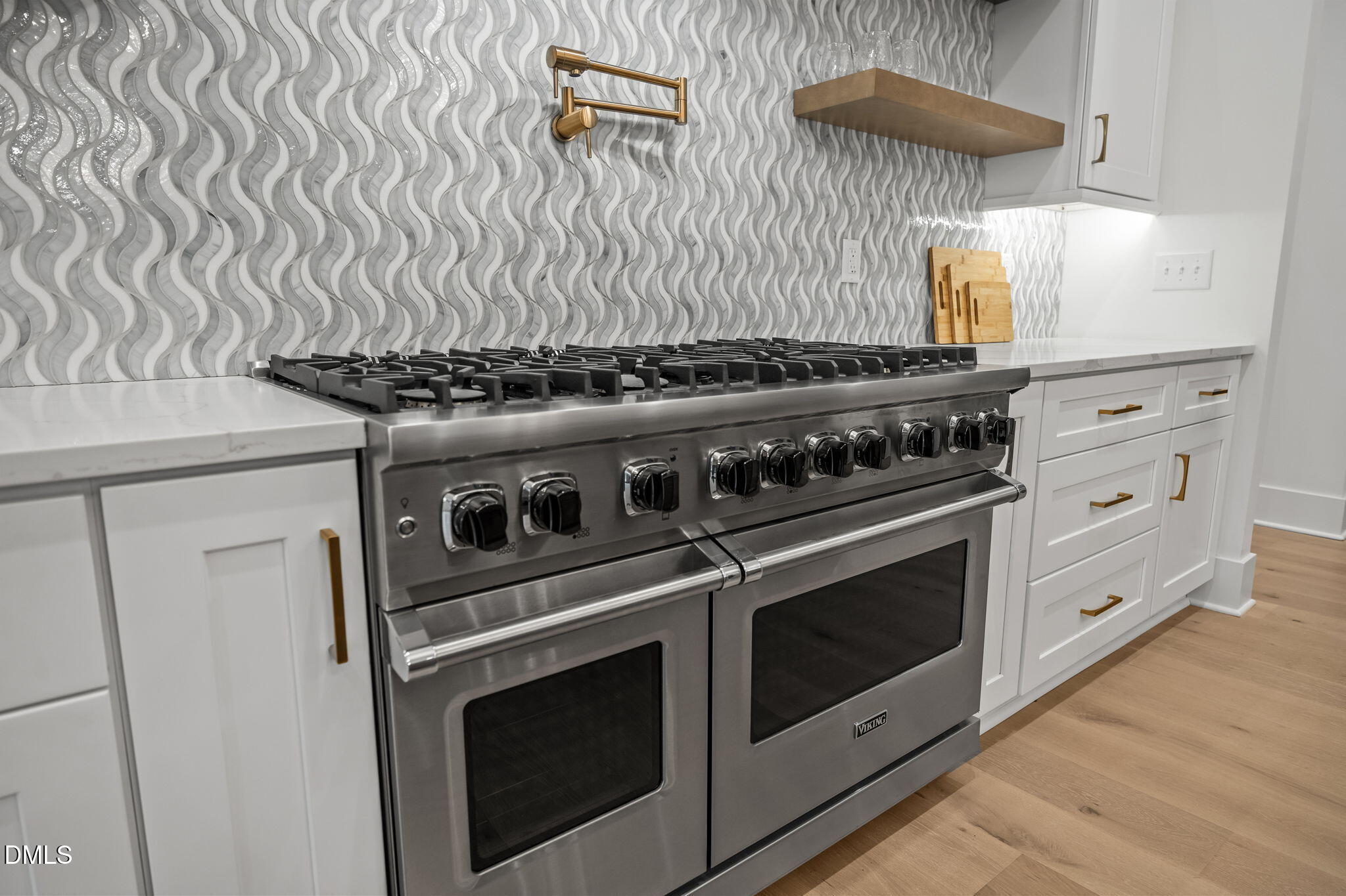 1312 Hunting Ridge Road Raleigh, NC 27615 - Photo 11 of 52 a stove top oven sitting inside of a kitchen