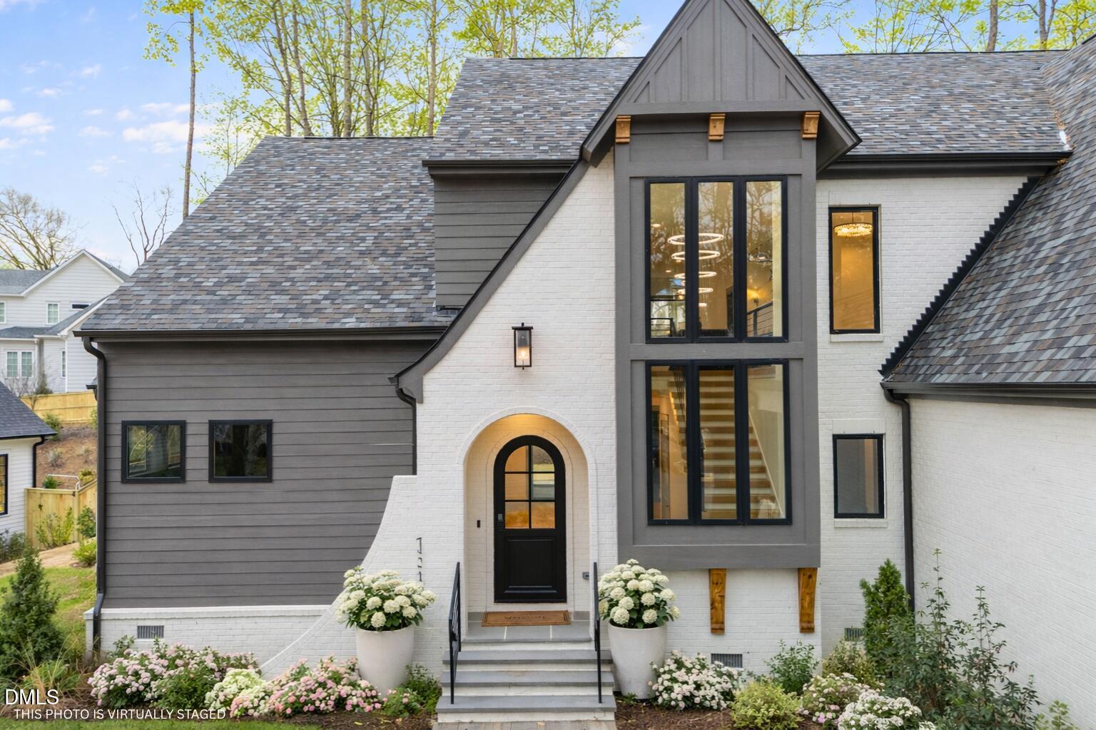1312 Hunting Ridge Road Raleigh, NC 27615 - Photo 2 of 52 a front view of a house with garden
