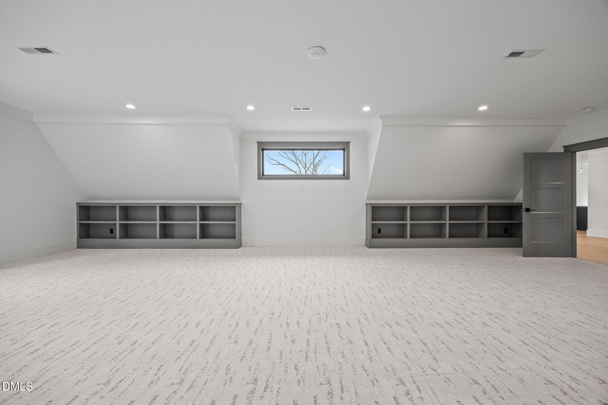 1312 Hunting Ridge Road Raleigh, NC 27615 - Photo 39 of 52 an empty room with wooden floor and windows