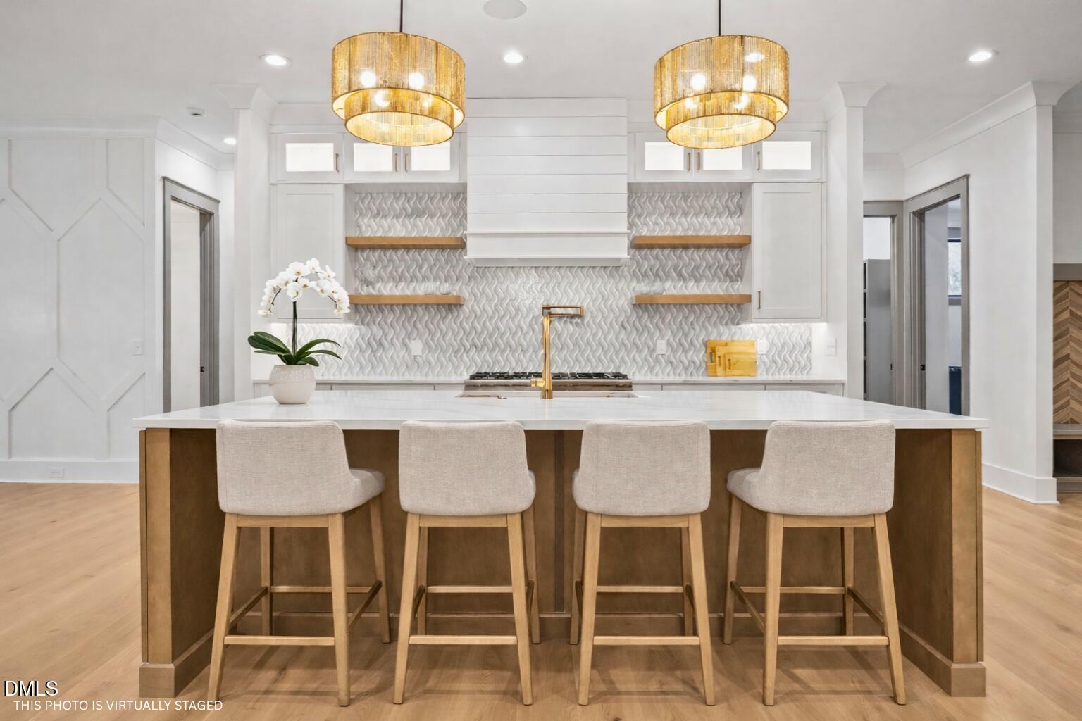 1312 Hunting Ridge Road Raleigh, NC 27615 - Photo 8 of 52 a kitchen with a dining table and chairs