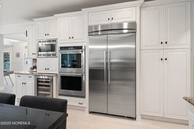a bathroom with a toilet a sink and a mirror