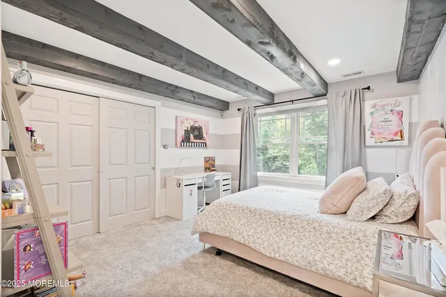 a bed room with a bed and a flat screen tv