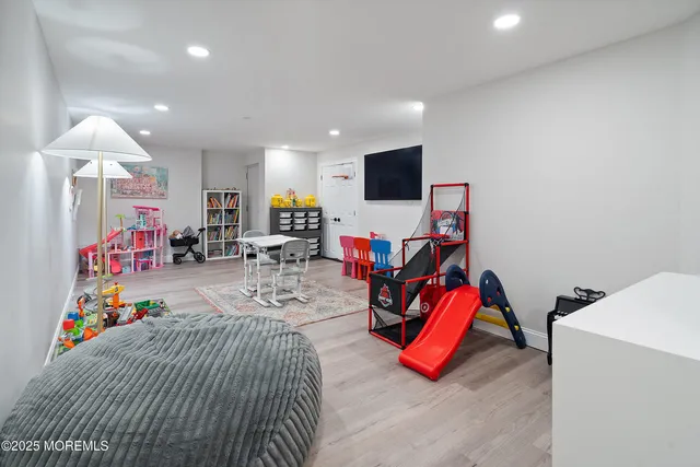 a view of a swimming pool with a yard and sitting area