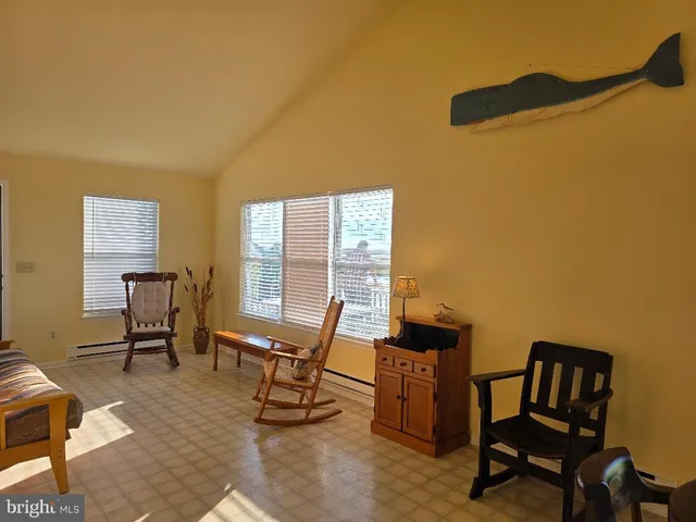 a workspace room with furniture and a window