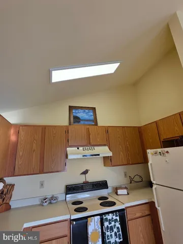 a kitchen with a cabinets and window