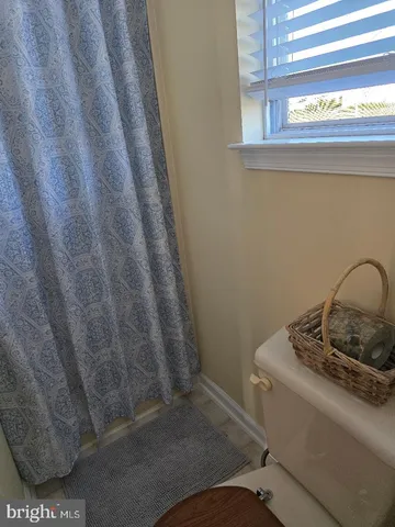a bathroom with a sink and a window