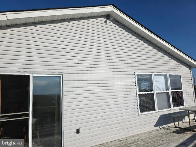 a view of backyard with windows