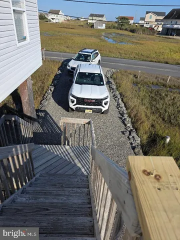 a view of a balcony with wooden floor