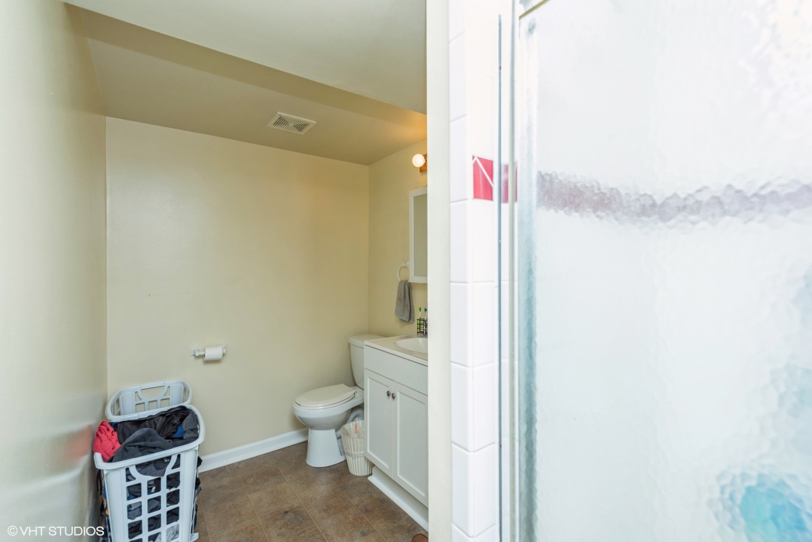 18524 West Geier Road Gurnee, IL 60031 - Photo 6 of 10 a bathroom with a toilet and a shower