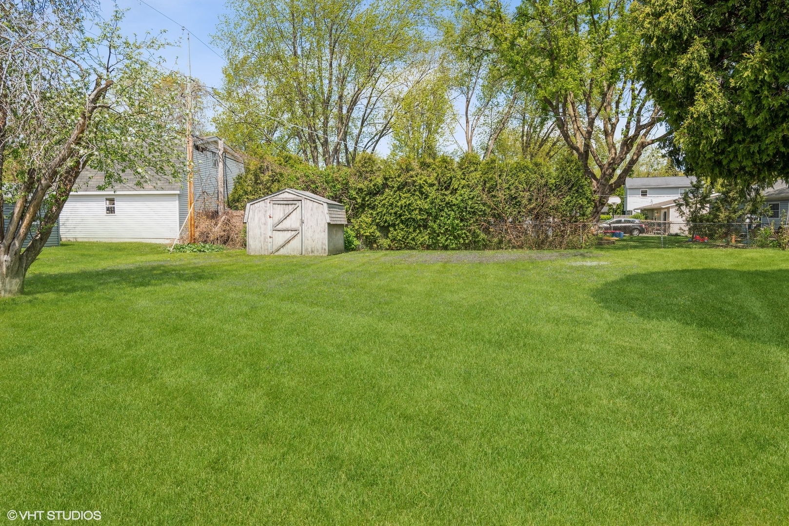 18524 West Geier Road Gurnee, IL 60031 - Photo 9 of 10 a front view of a house with a garden and trees