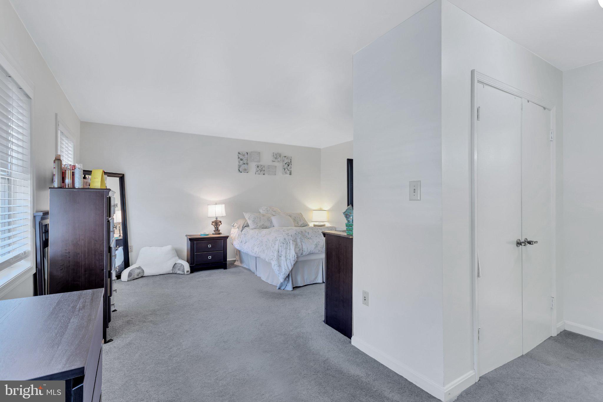 9009 Sweet Birch Court Springfield, VA 22152 - Photo 23 of 34 Serene bedroom with soft lighting.