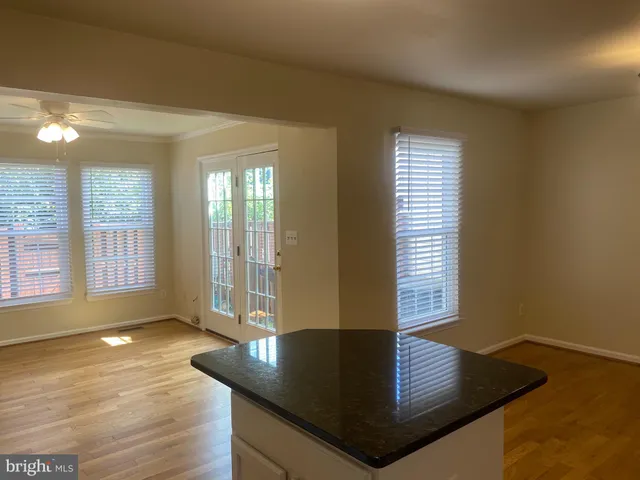 a kitchen with a refrigerator and a sink