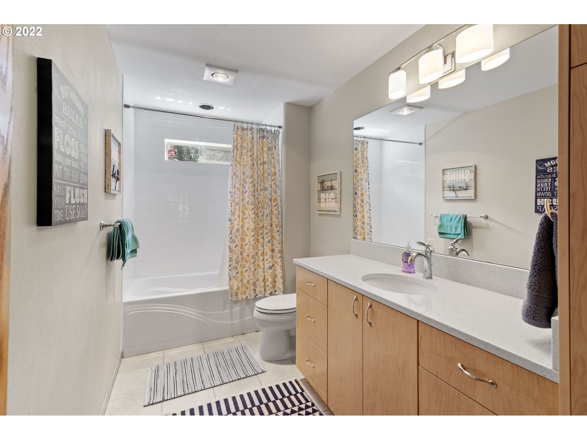 19601 Northeast 42nd Court Ridgefield, WA 98642 - Photo 32 of 32 a bathroom with a sink a toilet a mirror a vanity and shower