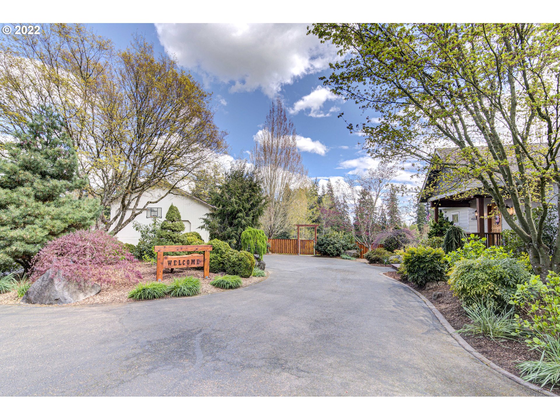 19601 Northeast 42nd Court Ridgefield, WA 98642 - Photo 4 of 32 a view of a backyard with large trees