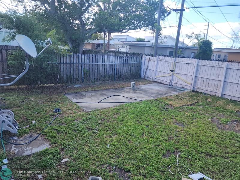 a view of a backyard with a swing