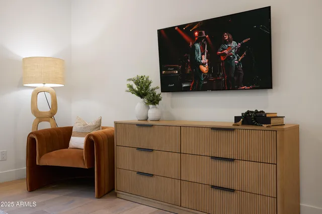 a spacious bedroom with a bed and a window