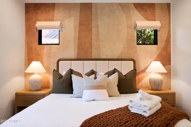 a bathroom with a granite countertop sink a mirror and a shower
