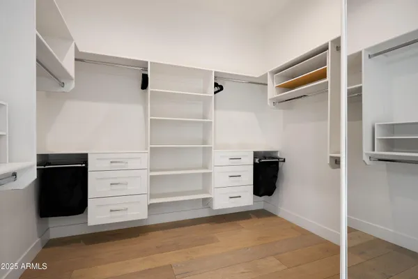 a bedroom with a bed and wall painting