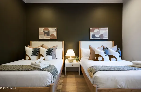 a bedroom with a bed and lamp