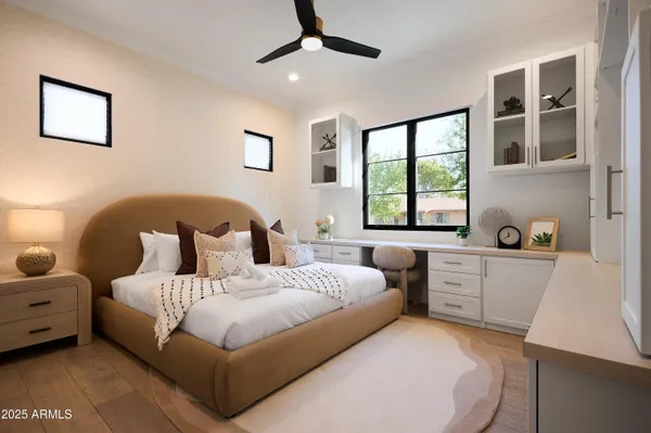 a kitchen with stainless steel appliances hardwood floor sink and cabinets