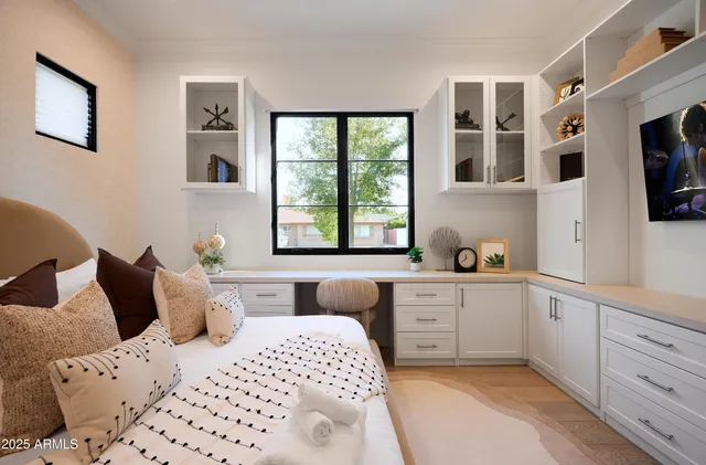 a bathroom with a granite countertop sink a toilet a mirror and shower