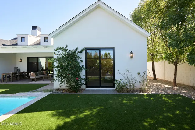 a front view of a house with swing plants and swimming pool