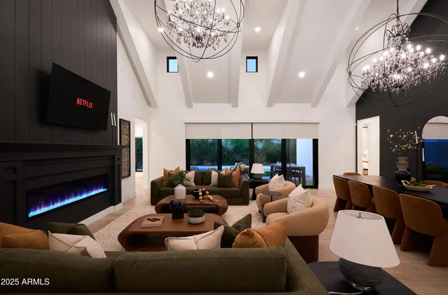 a living room with furniture and a large mirror