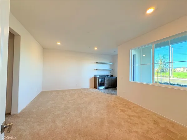 a view of a livingroom with a kitchen
