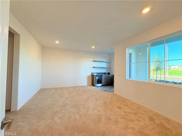 a view of a livingroom with a kitchen