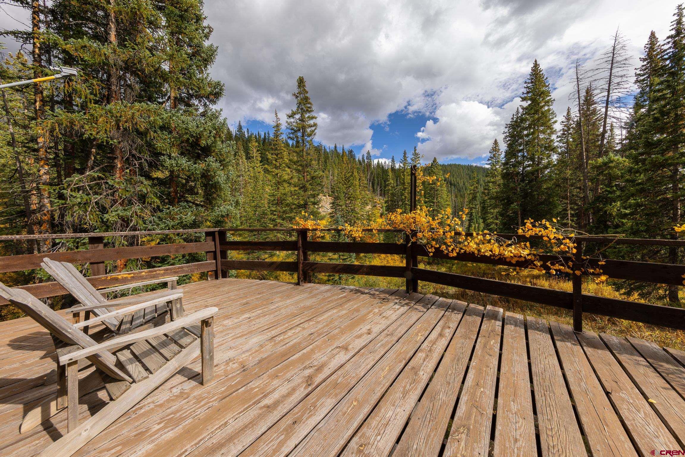 824 County Road Crested Butte, CO 81224 - Photo 11 of 39 a view of a terrace with wooden floor and city view