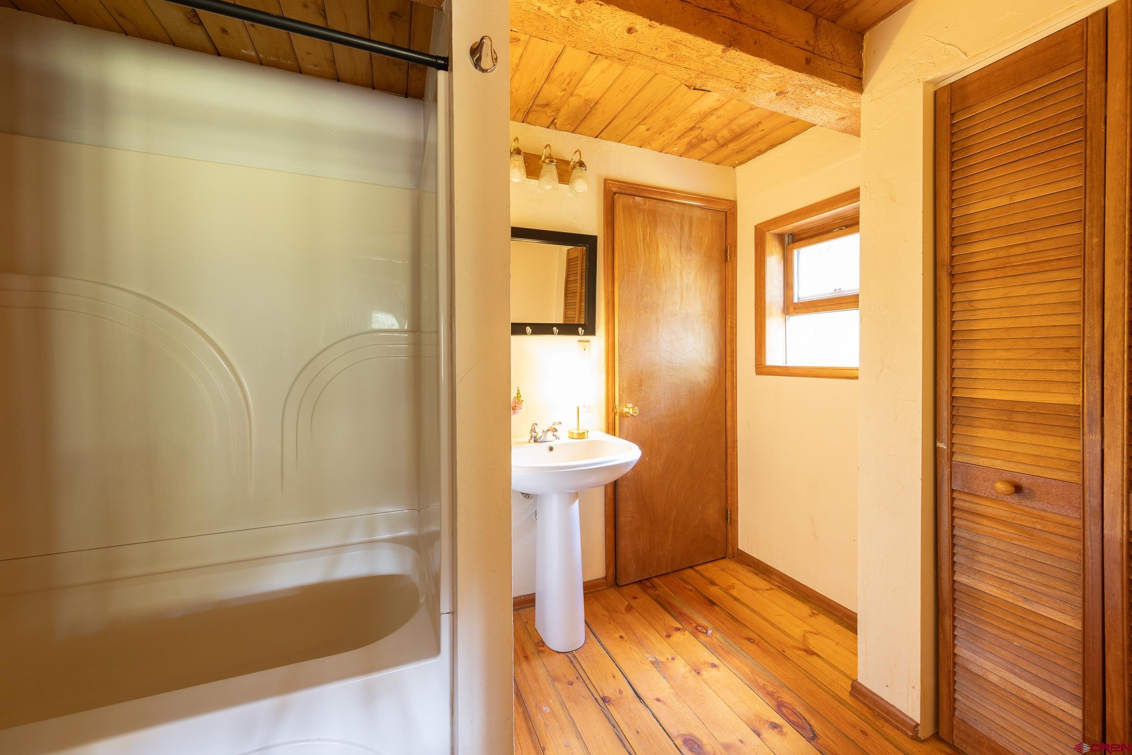 824 County Road Crested Butte, CO 81224 - Photo 30 of 39 a bathroom with a bathtub and a shower