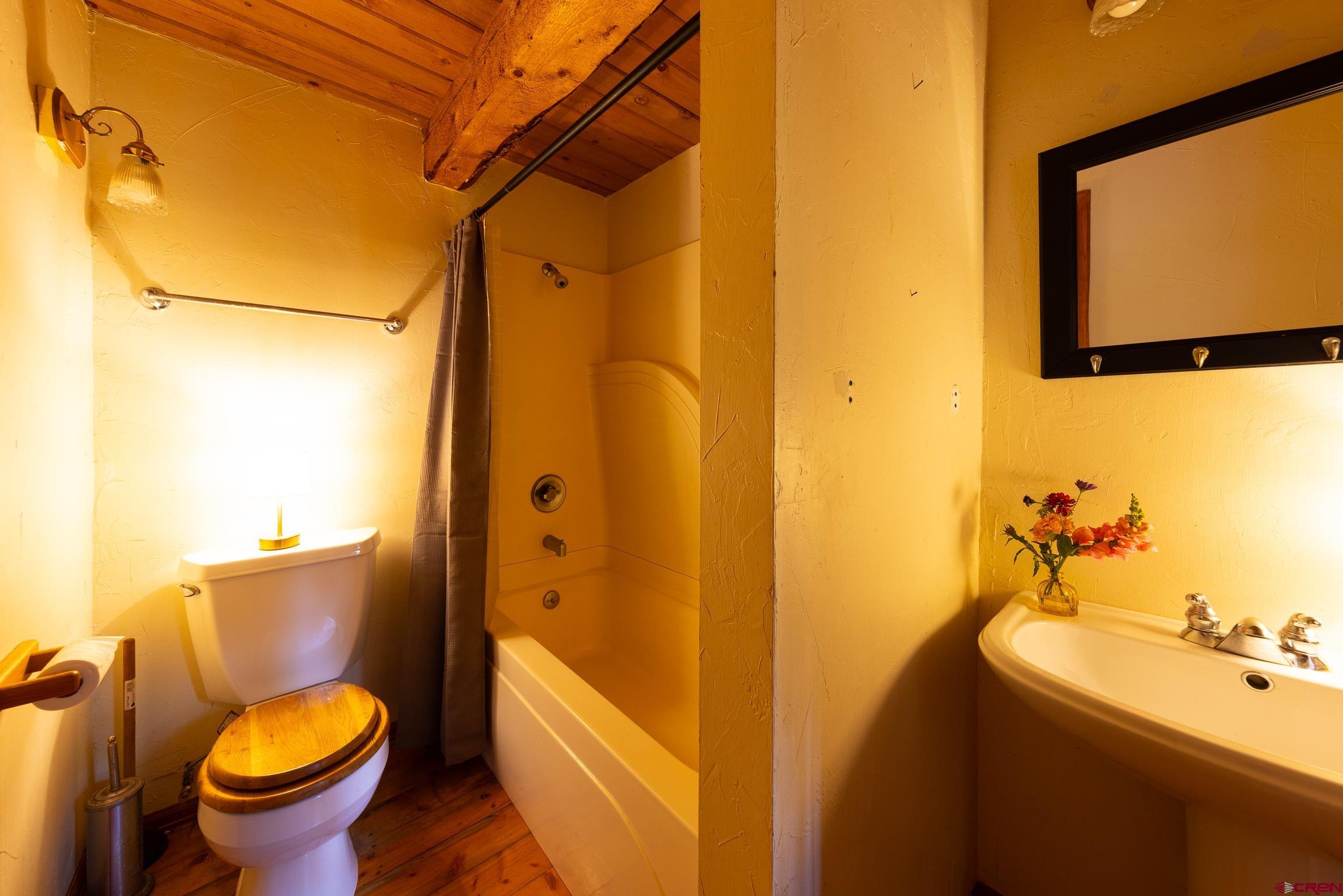824 County Road Crested Butte, CO 81224 - Photo 31 of 39 a bathroom with a sink toilet and shower