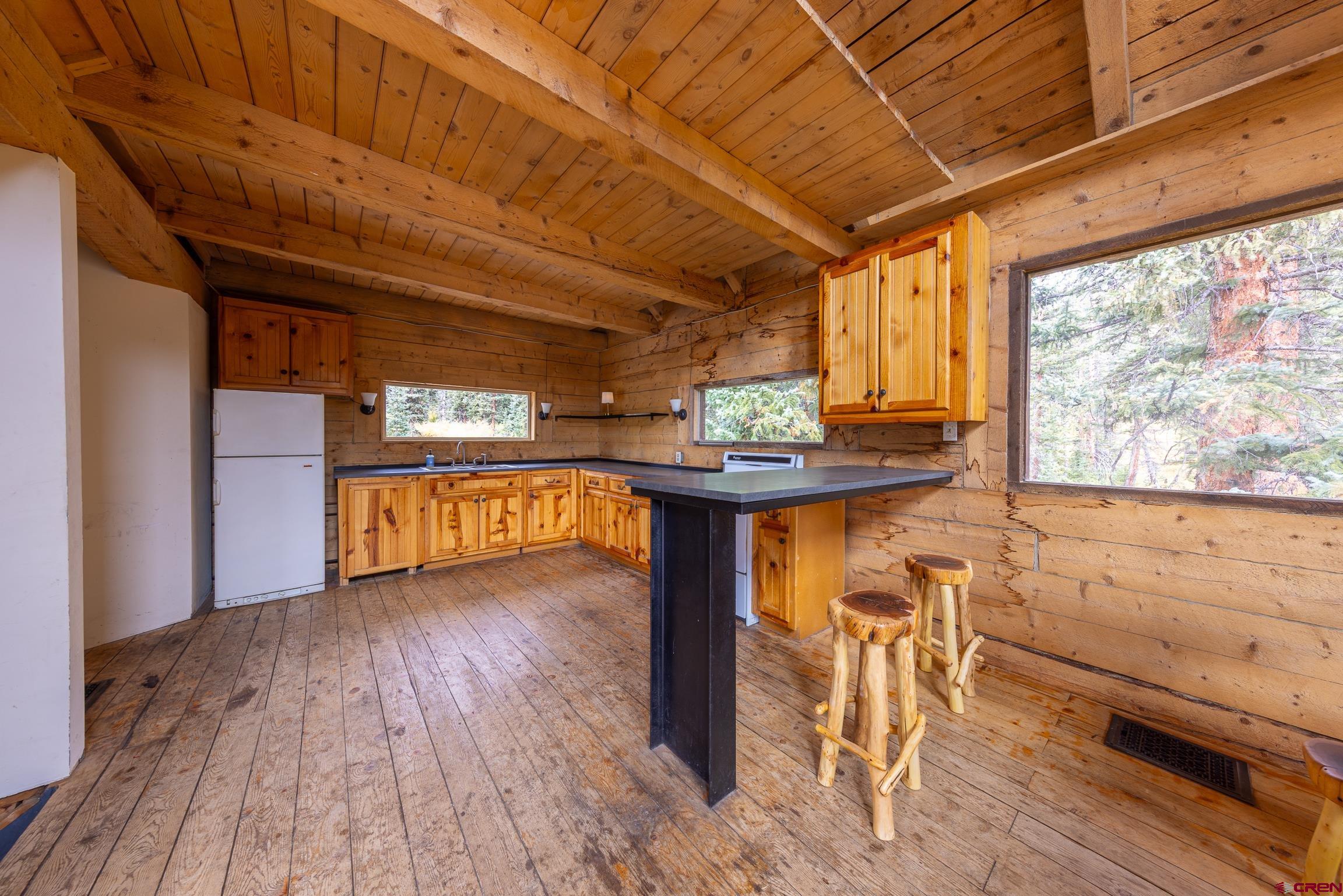 824 County Road Crested Butte, CO 81224 - Photo 5 of 39 a view of a room with wooden floor