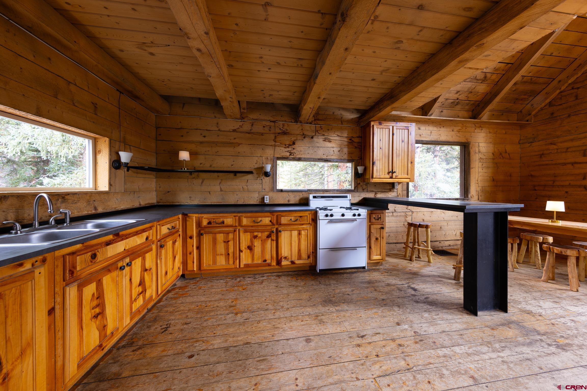 824 County Road Crested Butte, CO 81224 - Photo 6 of 39 a large kitchen with lots of counter space and windows