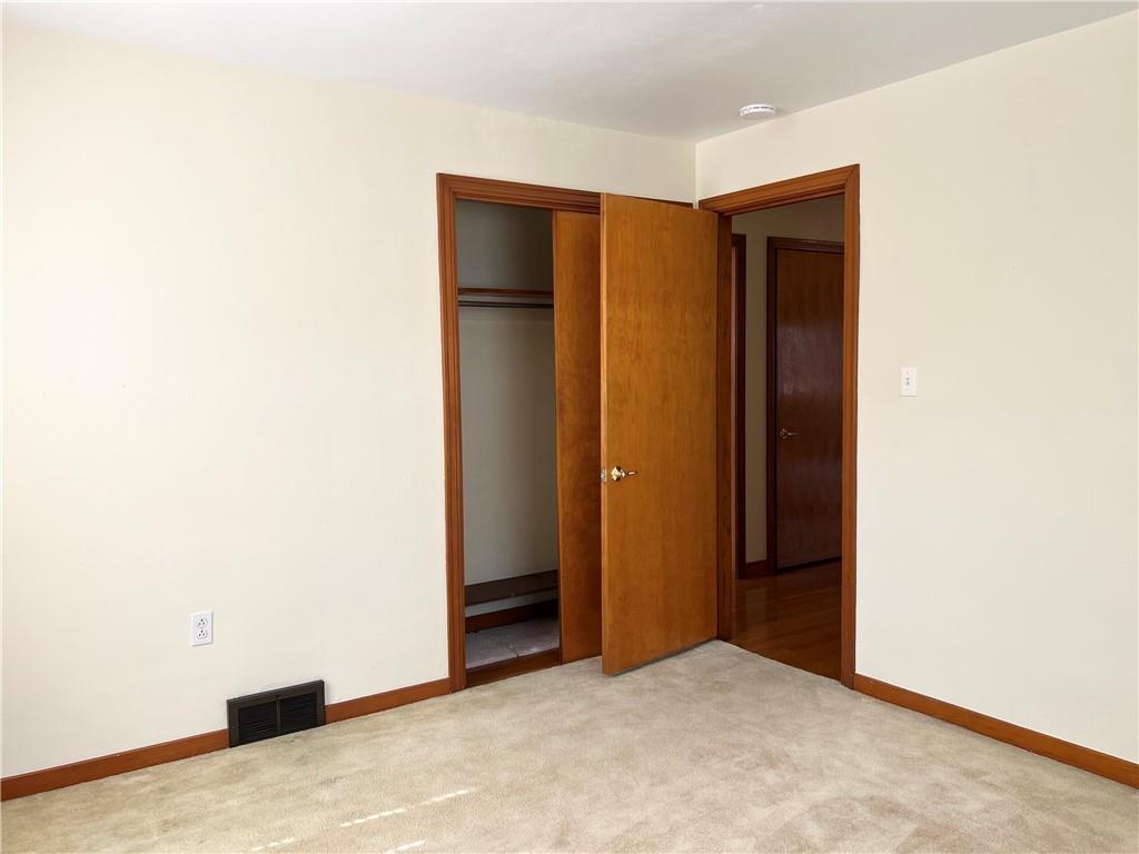 233 Reed Street Lower Burrell, PA 15068 - Photo 25 of 40 Bedroom 2 closet. Hardwood flooring under carpet.