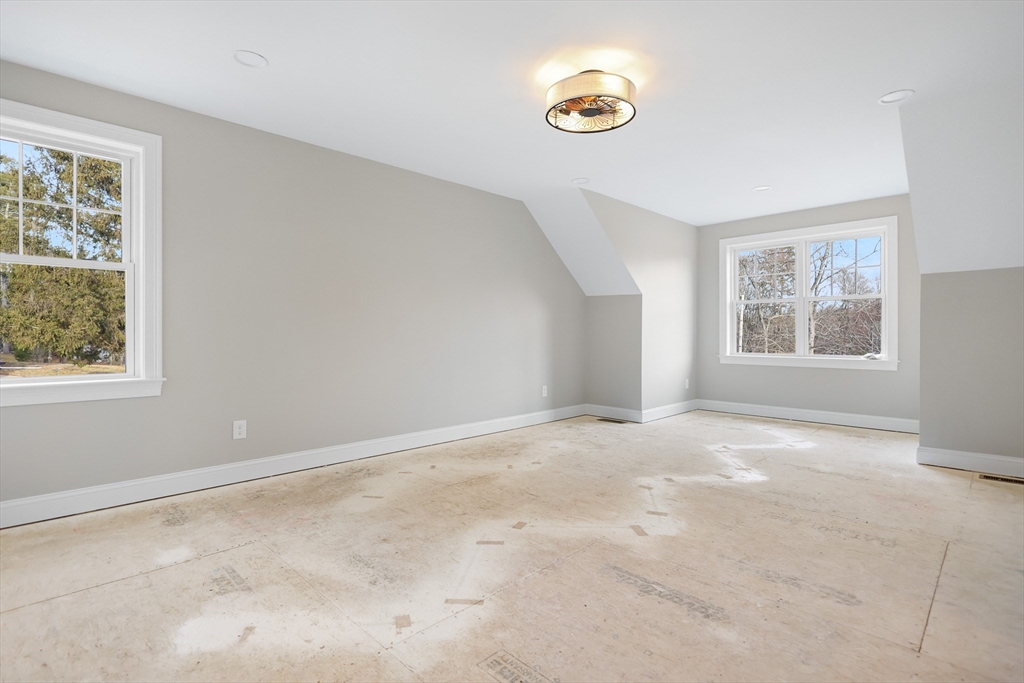 13 Main Street, Unit 13 Newbury, MA 01922 - Photo 18 of 36 an empty room with windows