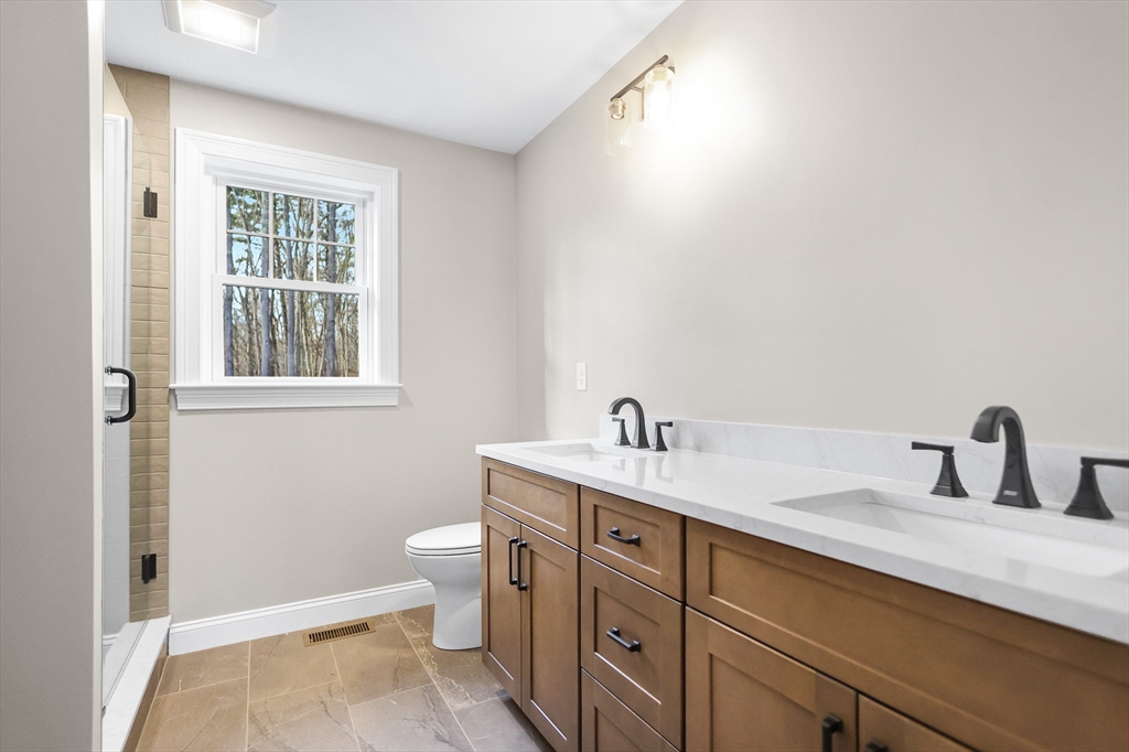 13 Main Street, Unit 13 Newbury, MA 01922 - Photo 20 of 36 a bathroom with a sink and a toilet