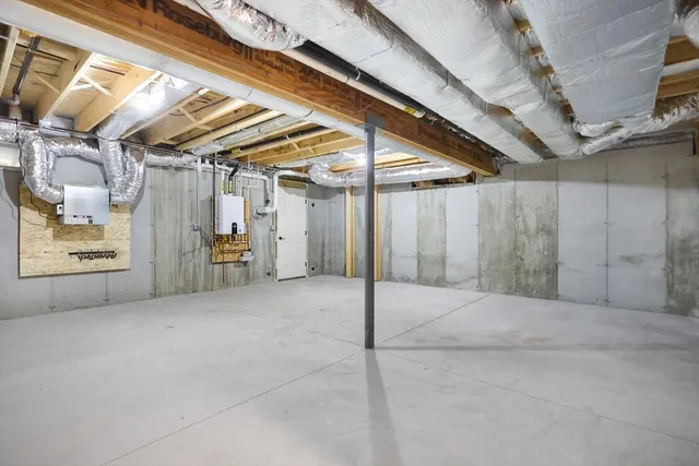 a view of an empty room with wooden fence