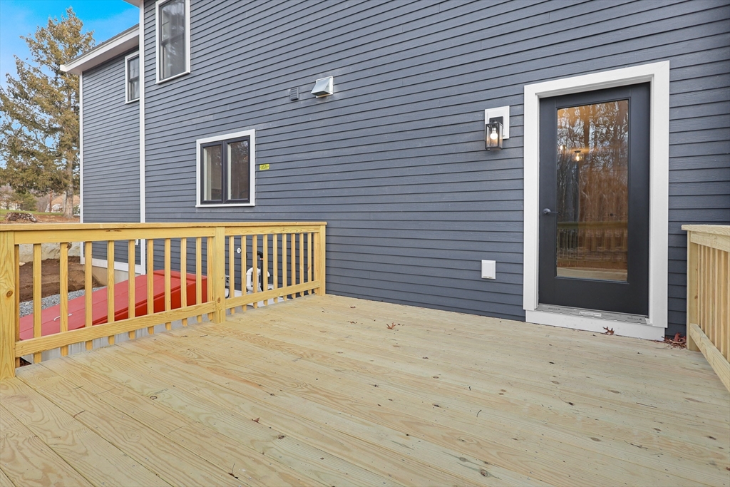 13 Main Street, Unit 13 Newbury, MA 01922 - Photo 31 of 36 a view of an empty room with wooden fence