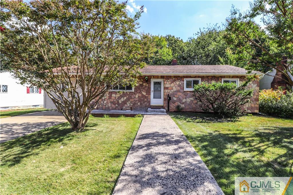 11 Brookside Road Edison, NJ 08817 - Photo 1 of 26 a front view of a house with garden
