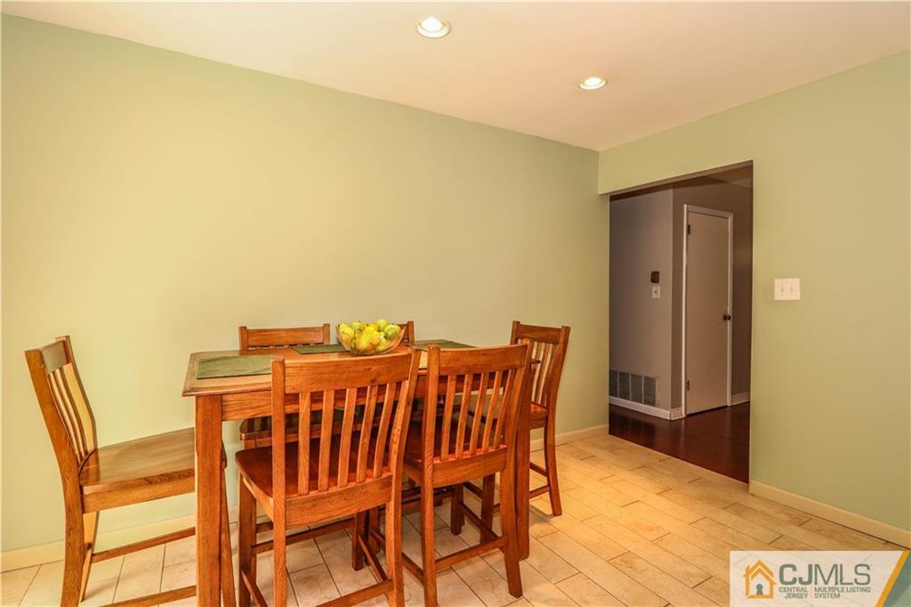 11 Brookside Road Edison, NJ 08817 - Photo 11 of 26 a view of a dining room with furniture and a table