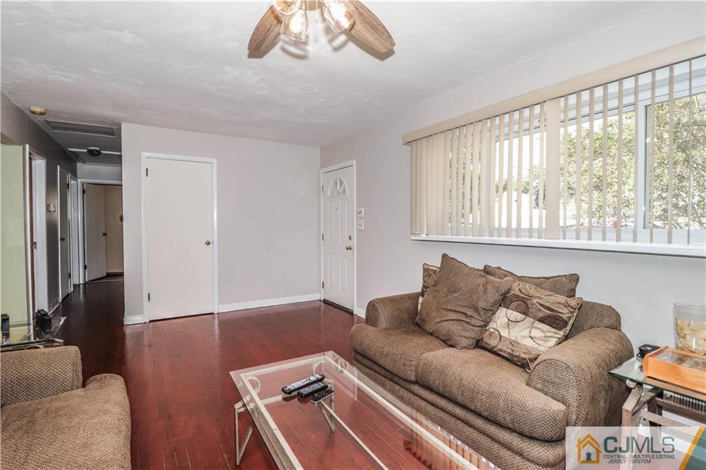 11 Brookside Road Edison, NJ 08817 - Photo 13 of 26 a living room with furniture and a large window