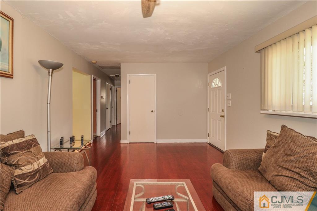 11 Brookside Road Edison, NJ 08817 - Photo 14 of 26 a living room with furniture and a window