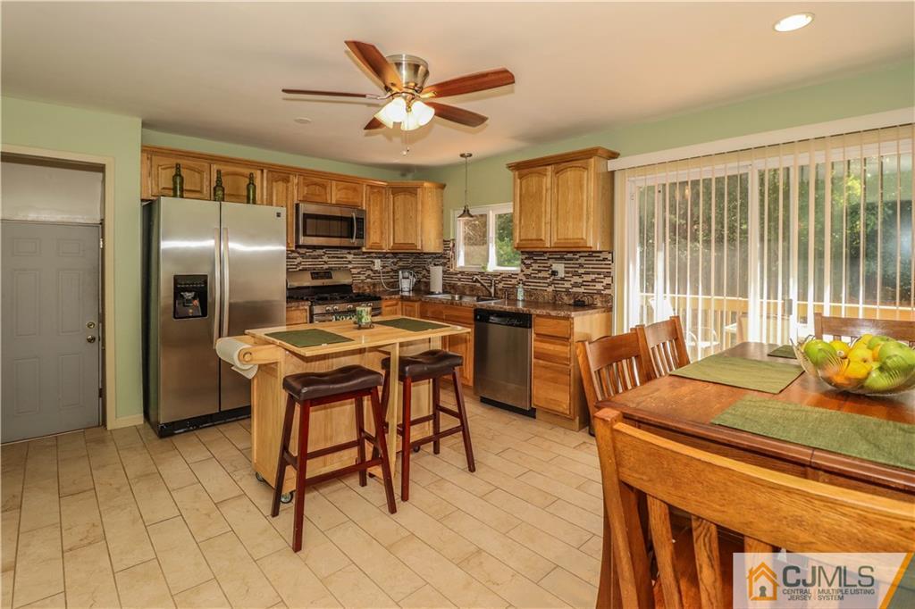 11 Brookside Road Edison, NJ 08817 - Photo 7 of 26 a kitchen with a sink appliances and cabinets