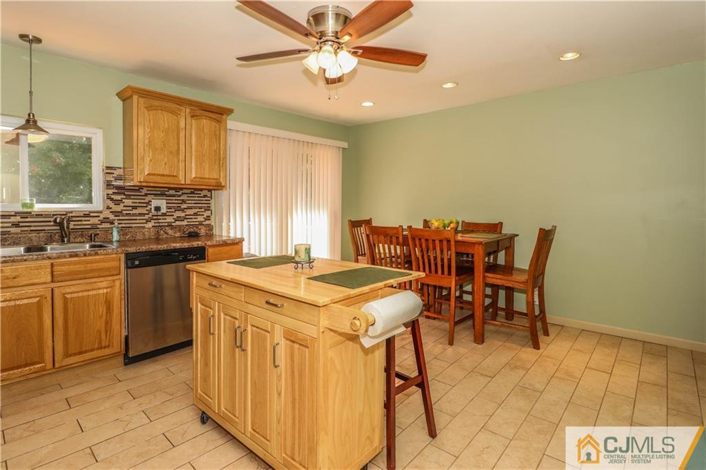 11 Brookside Road Edison, NJ 08817 - Photo 9 of 26 a kitchen with a stove a sink dishwasher and a refrigerator
