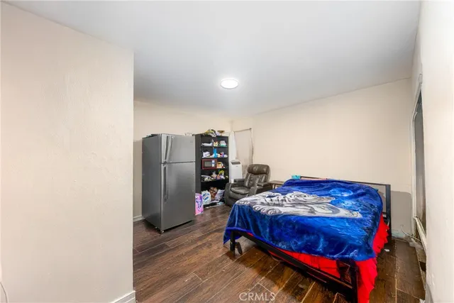 a bedroom with a bed and a closet