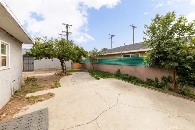 a view of backyard with a garden and plants