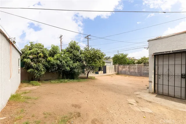 a view of a backyard of the house