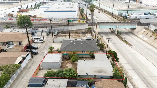 an aerial view of a house with a garden and plants