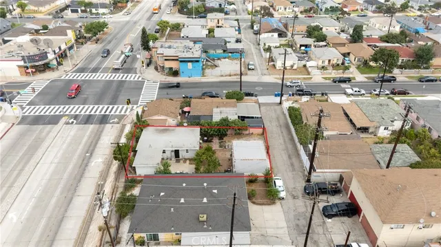an aerial view of residential houses with outdoor space